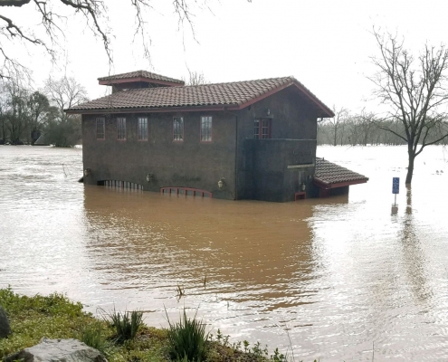 The tasting room fully surrounded by floodwaters, approximately 6 feet high.